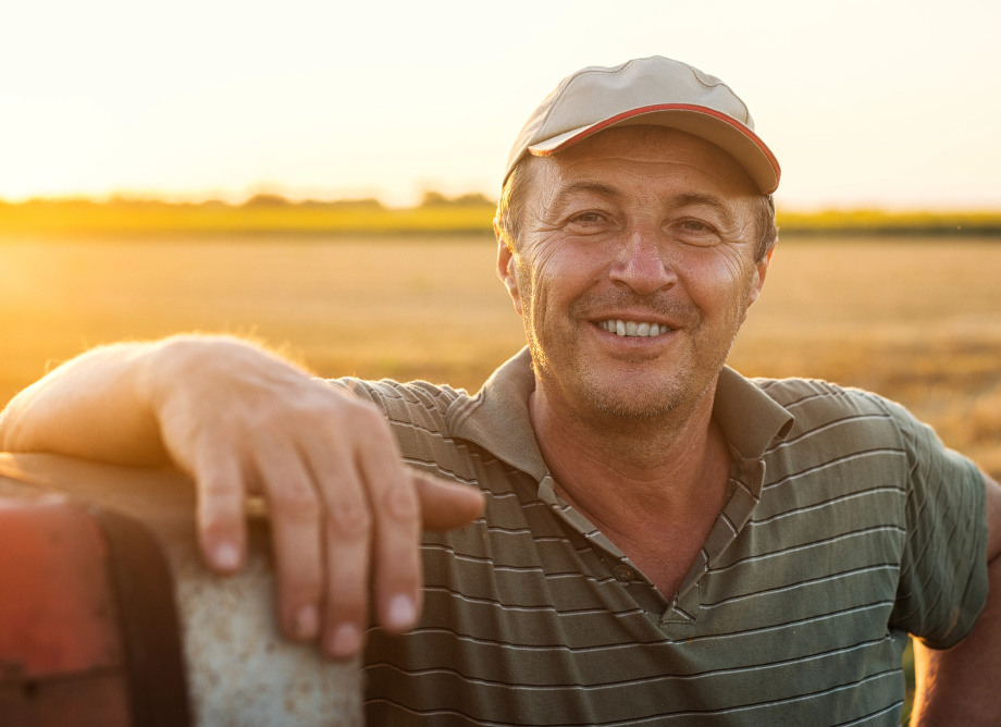 Man posing for picture in a farm