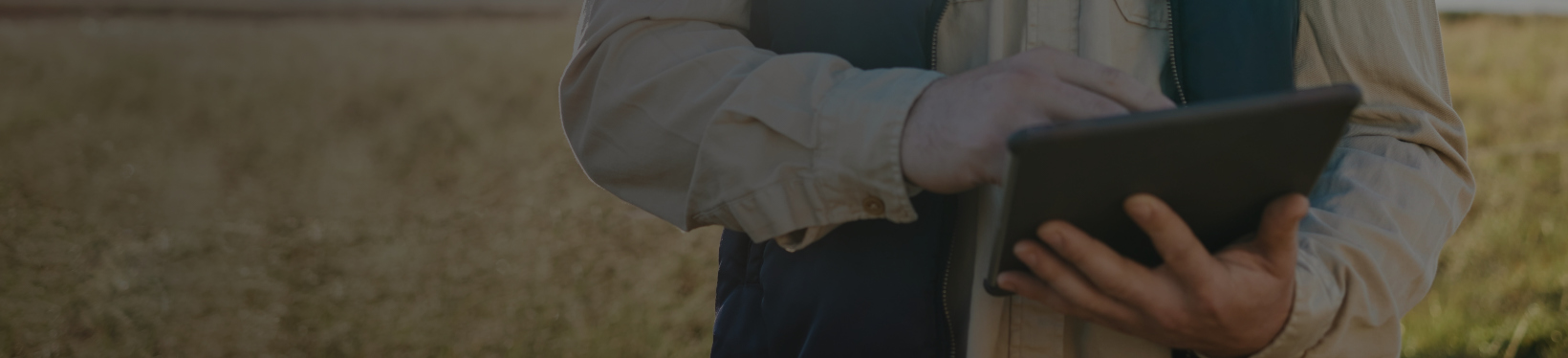 Man using tablet in a farm