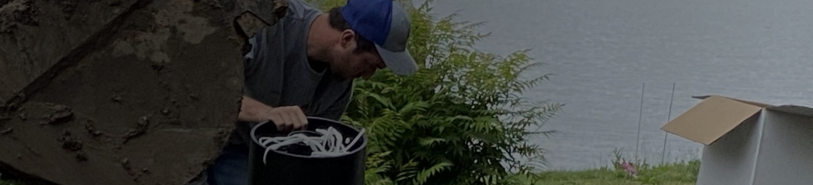 Man working near lake