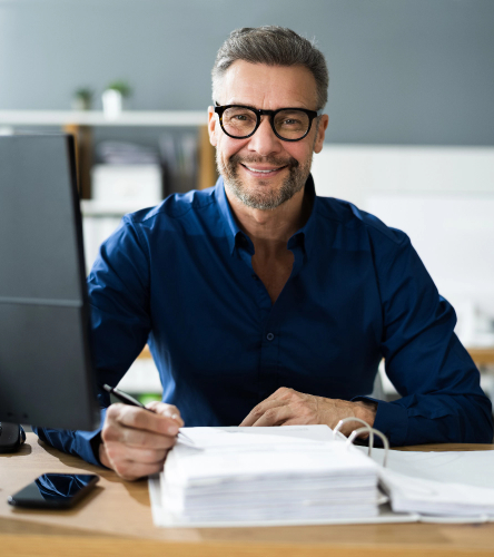 Man writing document in the office