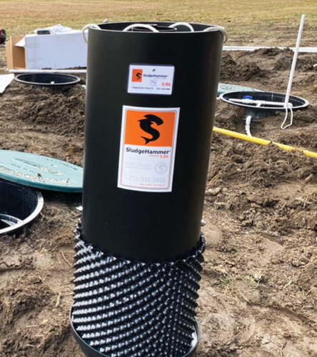 Sludgrhammer product being installed outside construction