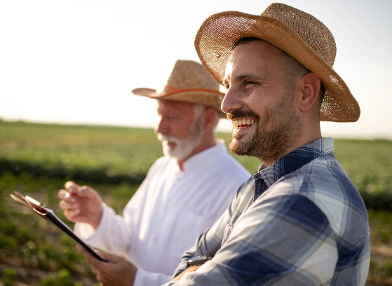 Two men working and smiling