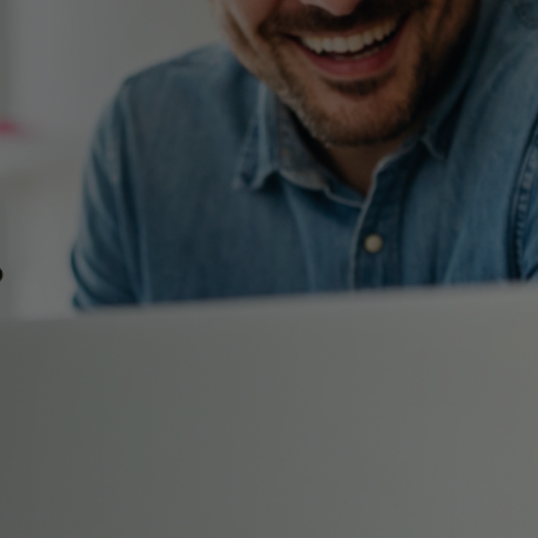 Man smiling and working at the office