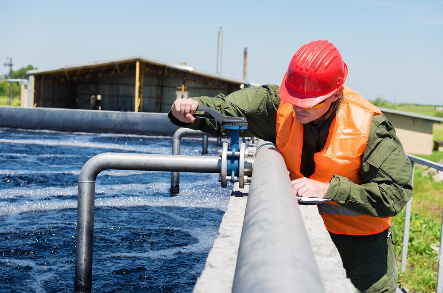 Man working near pipe