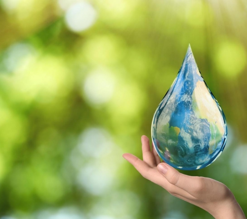 Hand holding water drop