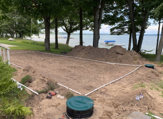 Sludgehammer excavation near lake