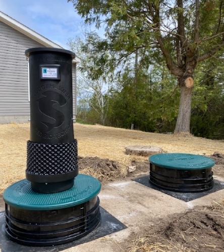 Sludgrhammer product being installed near house